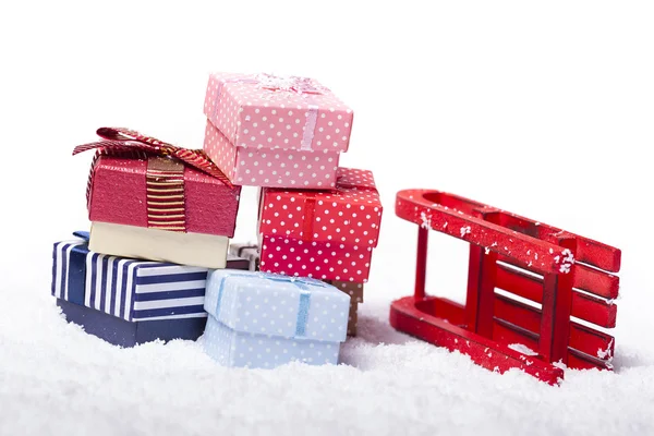 Red sled and gift boxes — Stock Photo, Image