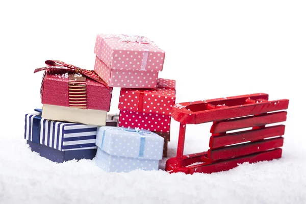 Red sled and gift boxes — Stock Photo, Image