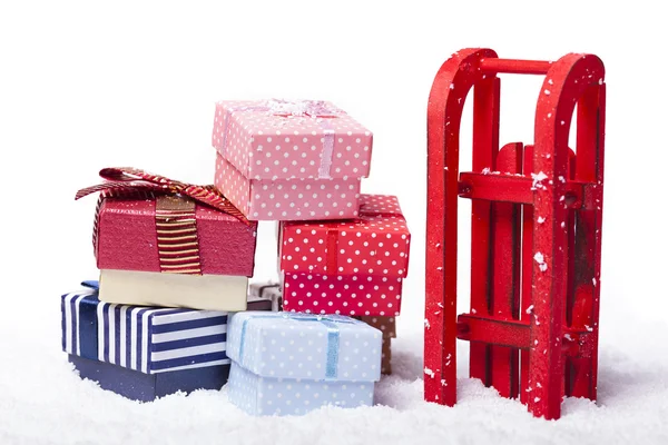 Red sled full of gift boxes — Stock Photo, Image