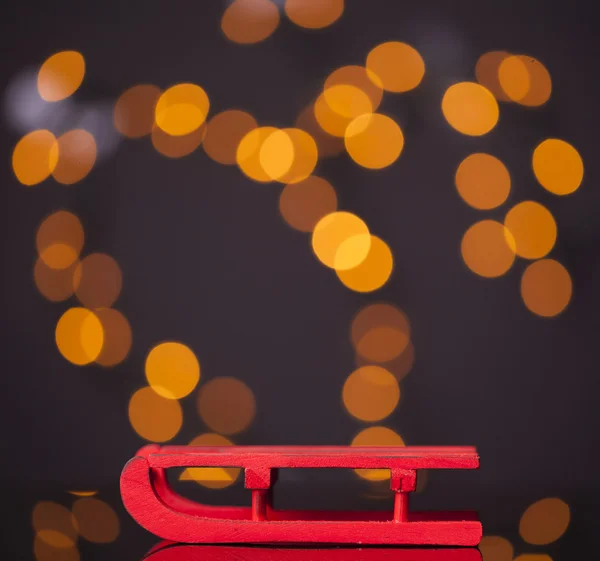 Red sledge on dark background — Stock Photo, Image