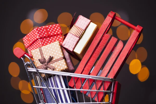 Shopping cart full of gift boxes — Stock Photo, Image