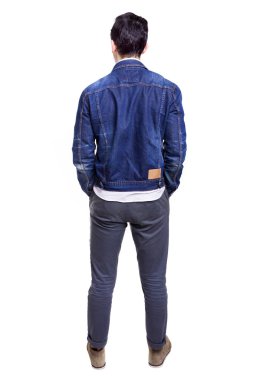 Young casual man standing from back