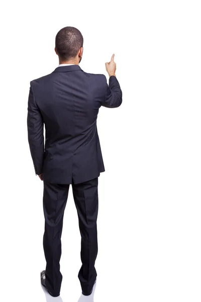 Rear view of a businessman pointing Stock Image