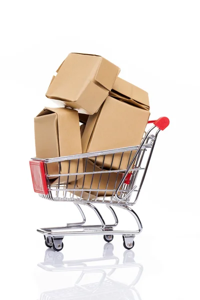 Shopping cart full of cardboard boxes — Stock Photo, Image