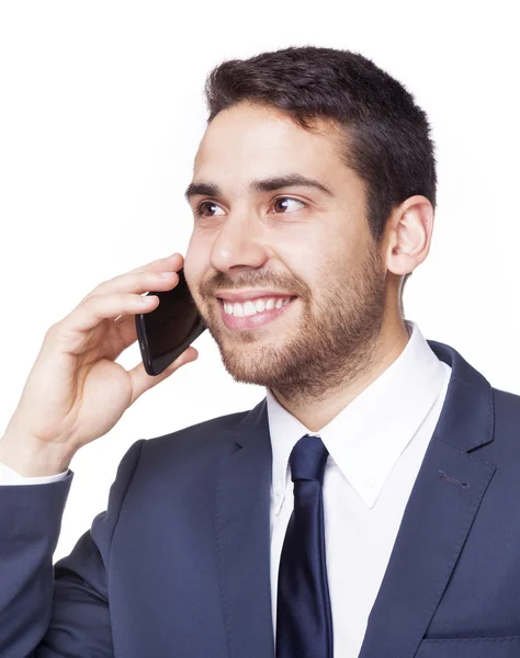 Mosolygó üzleti ember beszél a telefonon — Stock Fotó