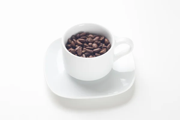 Tazza di caffè con chicchi di caffè — Foto Stock