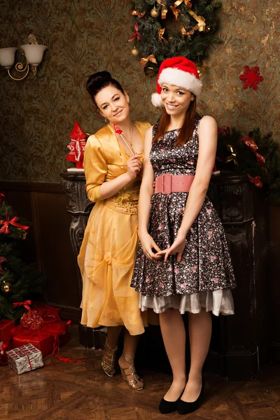 Portrait of two young woman posing  at New Year eve. — Stock Photo, Image