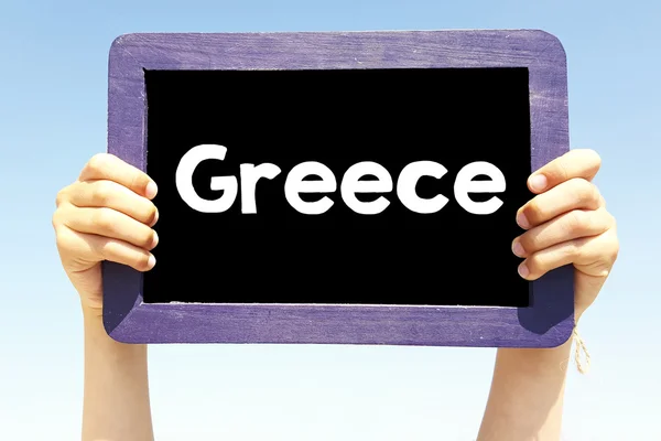 Grecja, napisany na tablicy w ręce — Zdjęcie stockowe