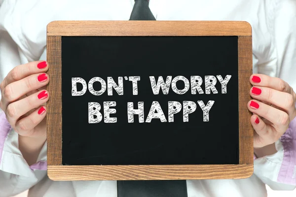 don\'t worry be happy inscription on blackboard