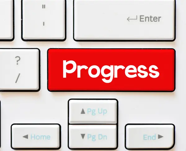 Inscripción de progreso en teclado blanco —  Fotos de Stock