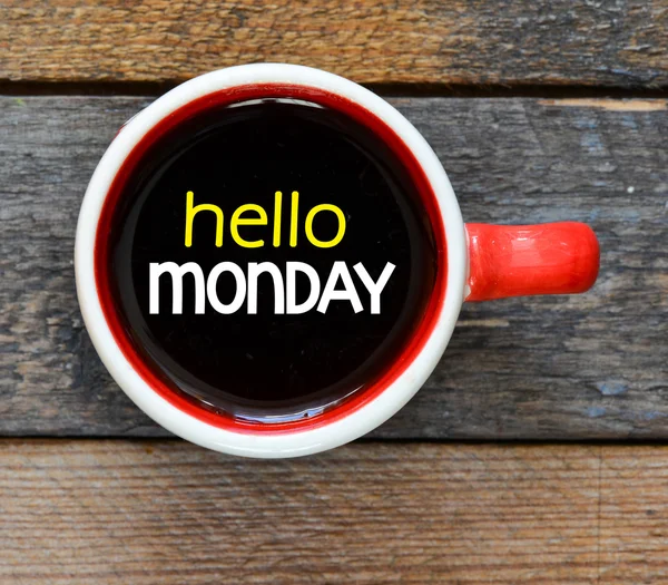 Inscription hello monday in cup of coffee — Stock Photo, Image