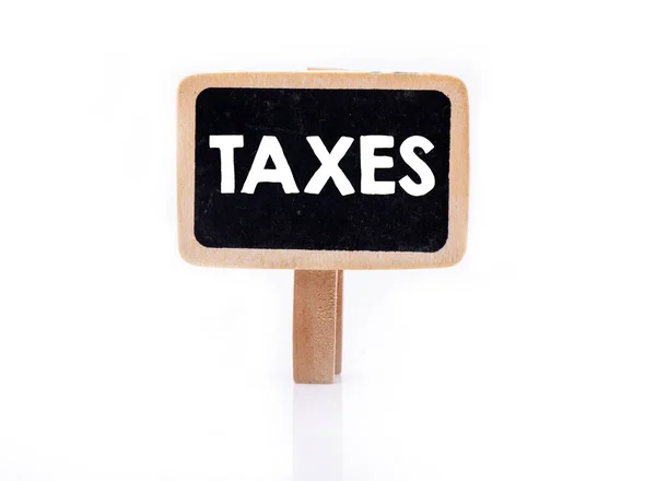 Taxes Słowo Małej Tablicy Białym Tle Pojęcie Przedsiębiorstwa — Zdjęcie stockowe