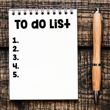 TO DO LIST words written in an office notebook. 