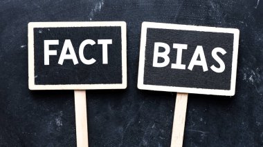 FACT BIAS text written on small chalk boards.  clipart