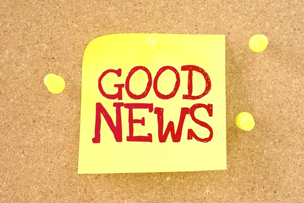 Text good news written by hand font on colored sticky note — Stock Photo, Image