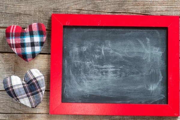 Blackboard decorated and handmade hearts — Stock Photo, Image