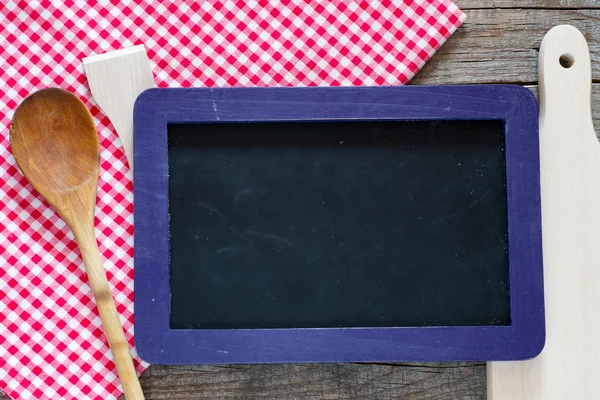 Blackboard with supplies — Stock Photo, Image