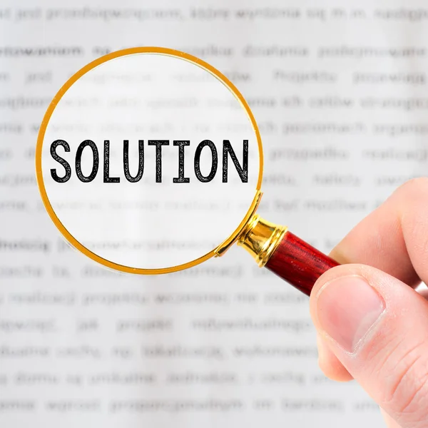 Magnifying glass and word "solution" — Stock Photo, Image