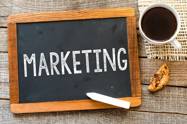 Marketing handwritten with white chalk — Stock Photo, Image