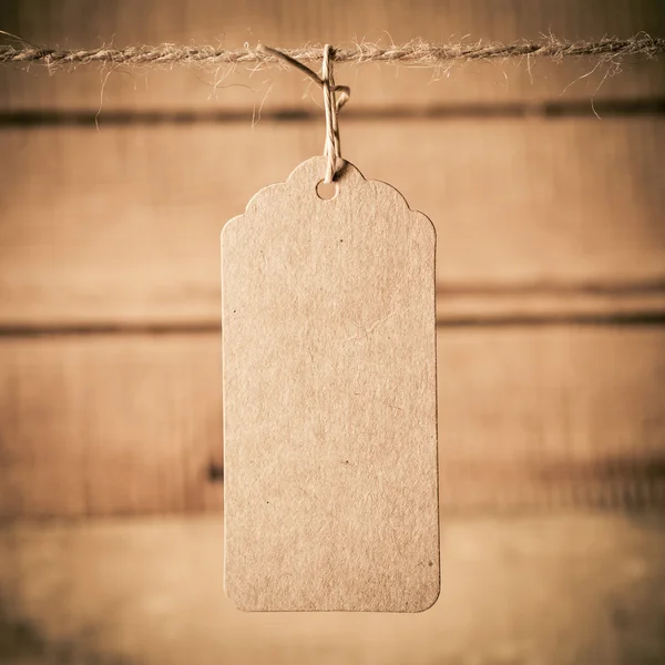 Price tag on wooden plank background — Stock Photo, Image