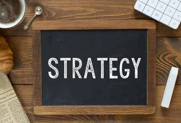 Strategy handwritten with white chalk — Stock Photo, Image