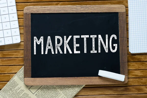 Marketing Handwritten with white chalk on a blackboard — Stock Photo, Image