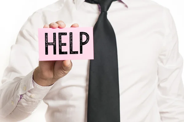 Man holding paper with help text — Stock Photo, Image