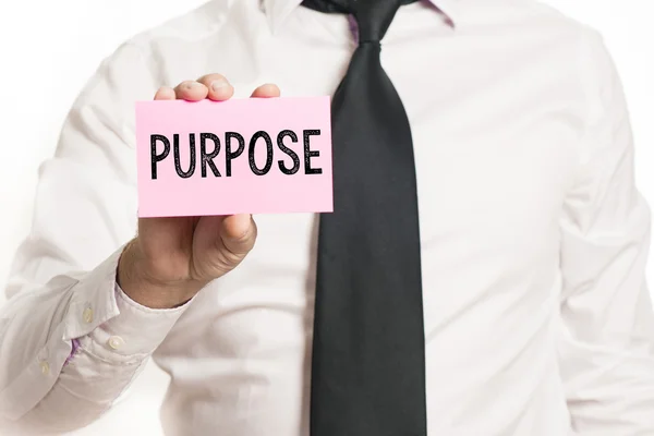 Man holding paper with purpose text — Stock Photo, Image