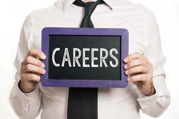 Careers Handwritten on a blackboard which holding man — Stock Photo, Image