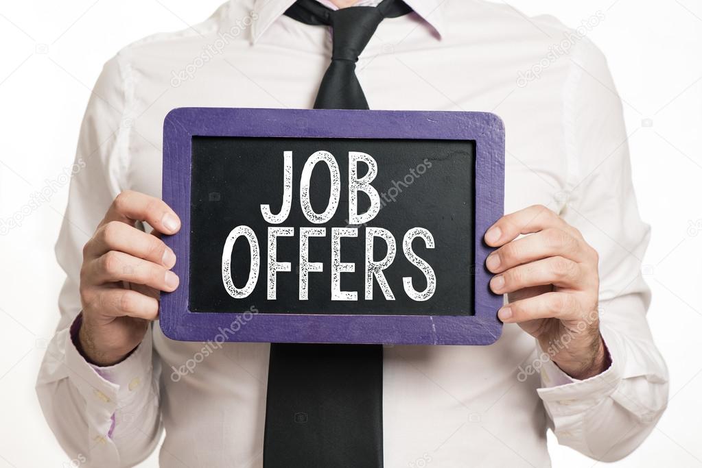 Job offers Handwritten on a blackboard which holding man
