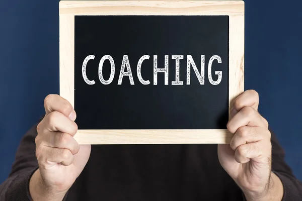 Tavlan med ordet coaching — Stockfoto