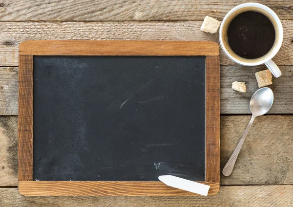 Blackboard and cup of coffee — Stock Photo, Image