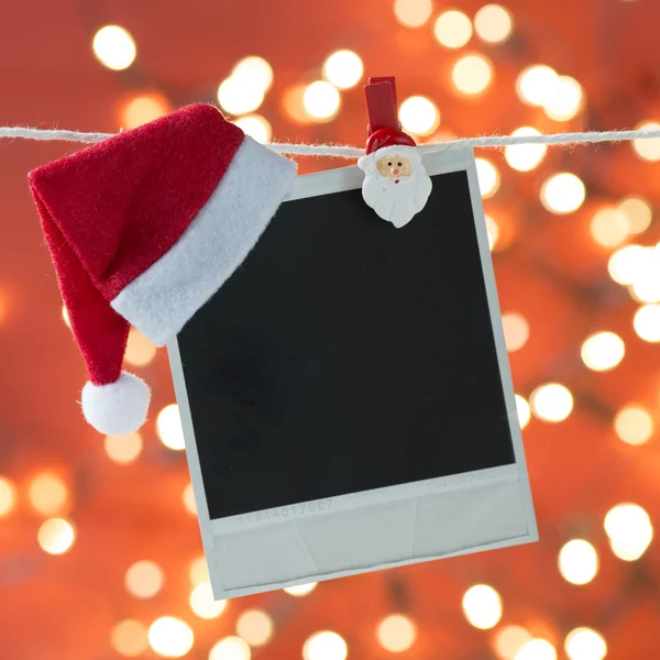 Photo frame with Santa hat — Stock Photo, Image