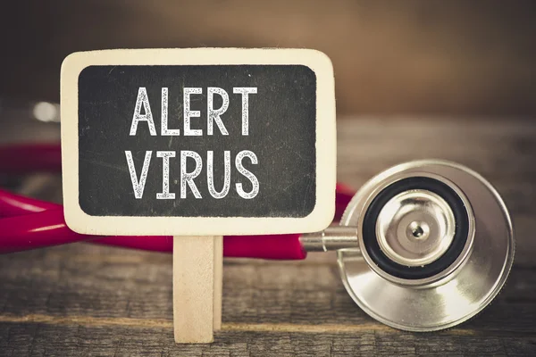 Alert  virus and stethoscope — Stock Photo, Image