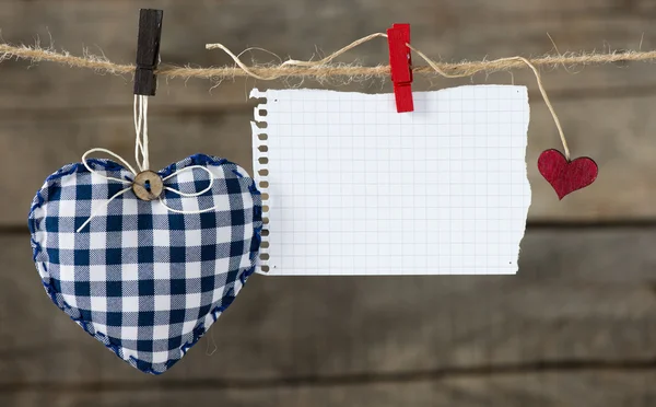 Hearts  with paper on rope — Stock Photo, Image