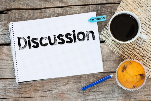 Notebook with discussion sign — Stock Photo, Image