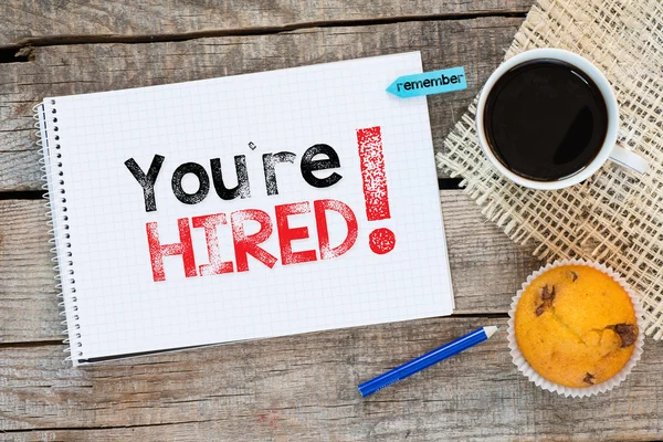 Notebook with you're hired ! sign — Stock Photo, Image