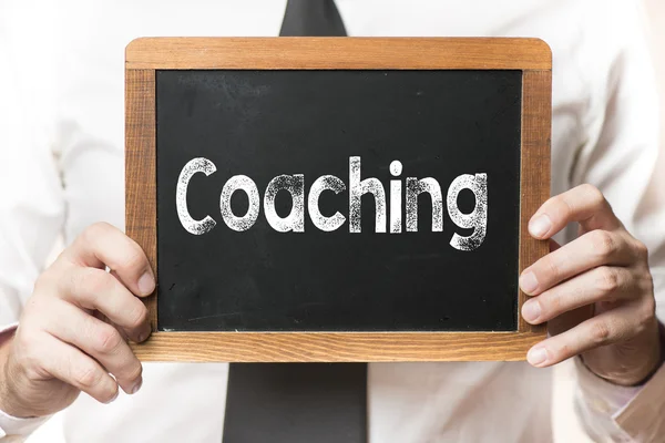 Empresário com palavra de coaching — Fotografia de Stock