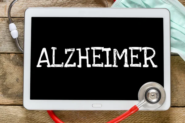 Tableta pc con la palabra Alzheimer —  Fotos de Stock