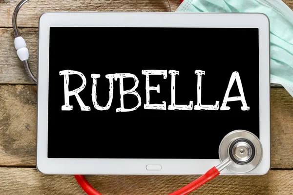 Tablet pc with word Rubella — Stock Photo, Image