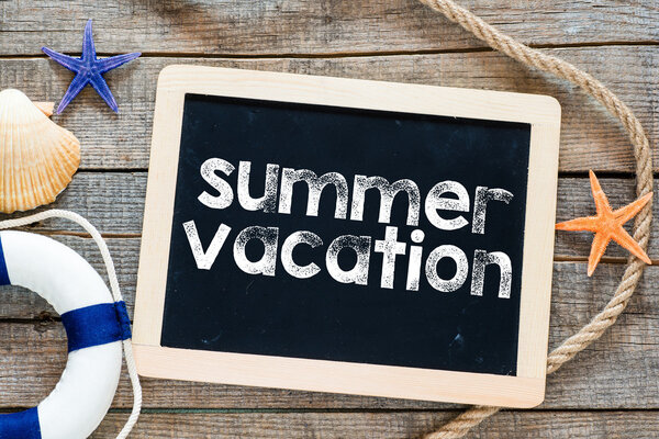 Summer vacation Text on blackboard