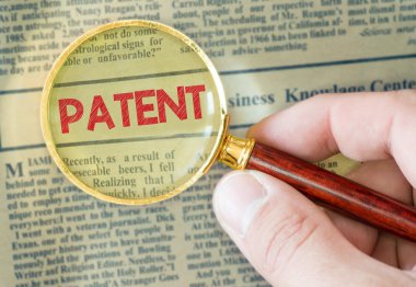 Patent  word with  magnifying glass clipart