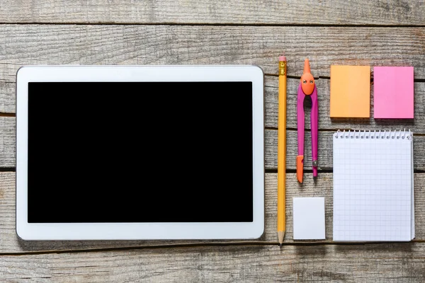 Tablet pc and school supplies — Stock Photo, Image