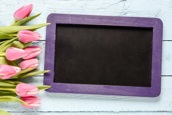 Pink Tulips with blackboard — Stock Photo, Image