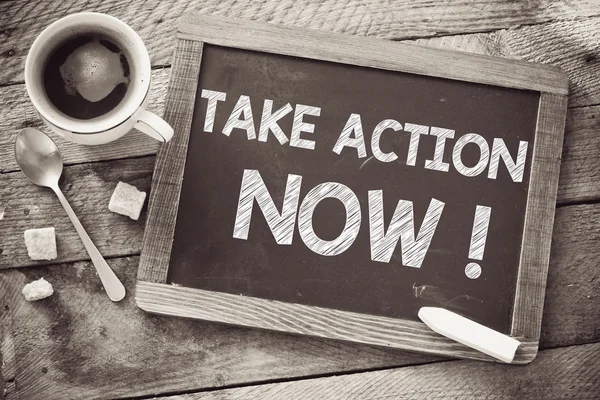 Blackboard with take action now — Stock Photo, Image