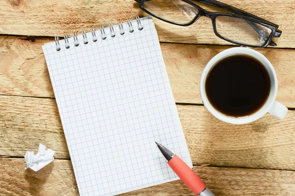 Notebook with cup of coffee — Stock Photo, Image