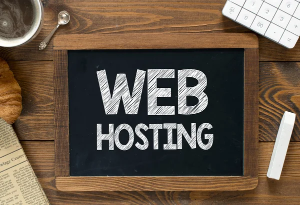 Web hosting handwritten on  blackboard — Stock Photo, Image