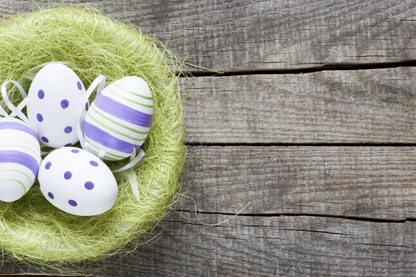 Decorated Easter eggs in nest — Stock Photo, Image