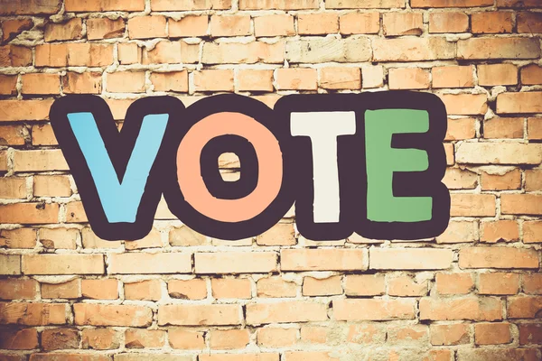 Vote On brick wall — Stock Photo, Image