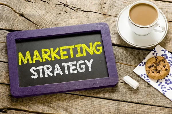 Marketing strategy on blackboard — Stock Photo, Image